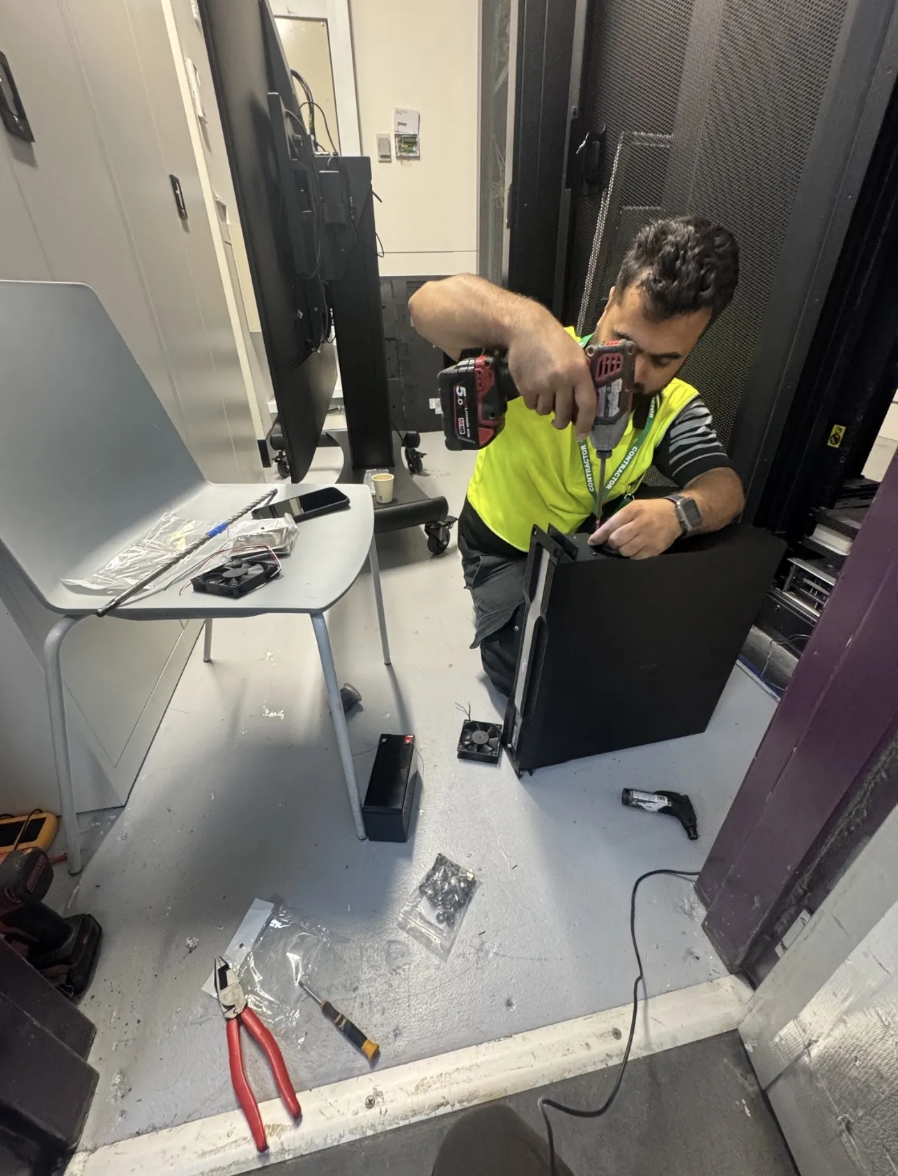 Abbott Security technician installing a CCTV system